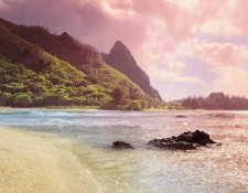 Haena, Kauai, Hawaii. Waiting long hours for the light that is late, traffic at a dead stop, papers piled so high on your desk you cannot see over them, no time for lunch. It is behind you now; you can feel the sand between your toes and the coolness of the water. It is a special place that allows us to forget and be revitalized. Tunnels beach was wonderful this day, drifting rain clouds broken by bright bursts of sunlight as my tripod sat low in the surf wating for just the right moment.